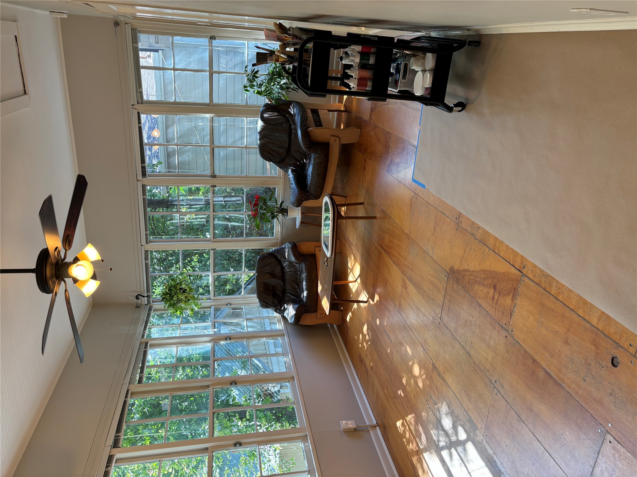 317 West 35th Street, Unit B Austin, TX 78705 - Photo 5 of 9 a living room with furniture and large windows