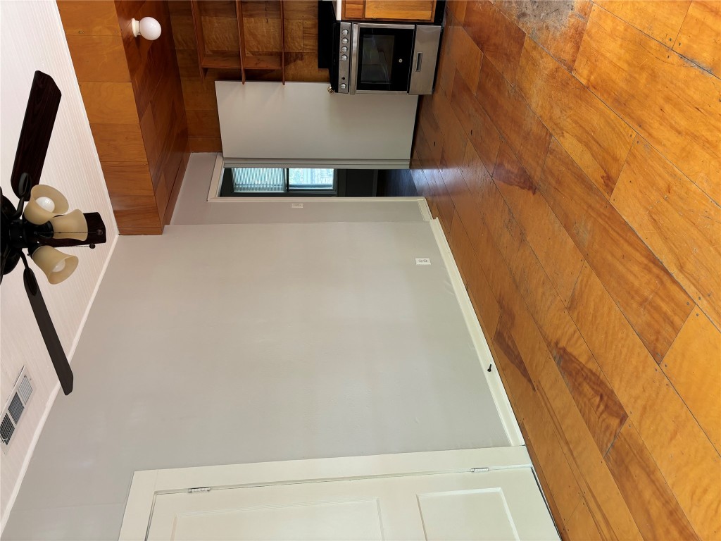 317 West 35th Street, Unit B Austin, TX 78705 - Photo 6 of 9 a view of an empty room with a fireplace