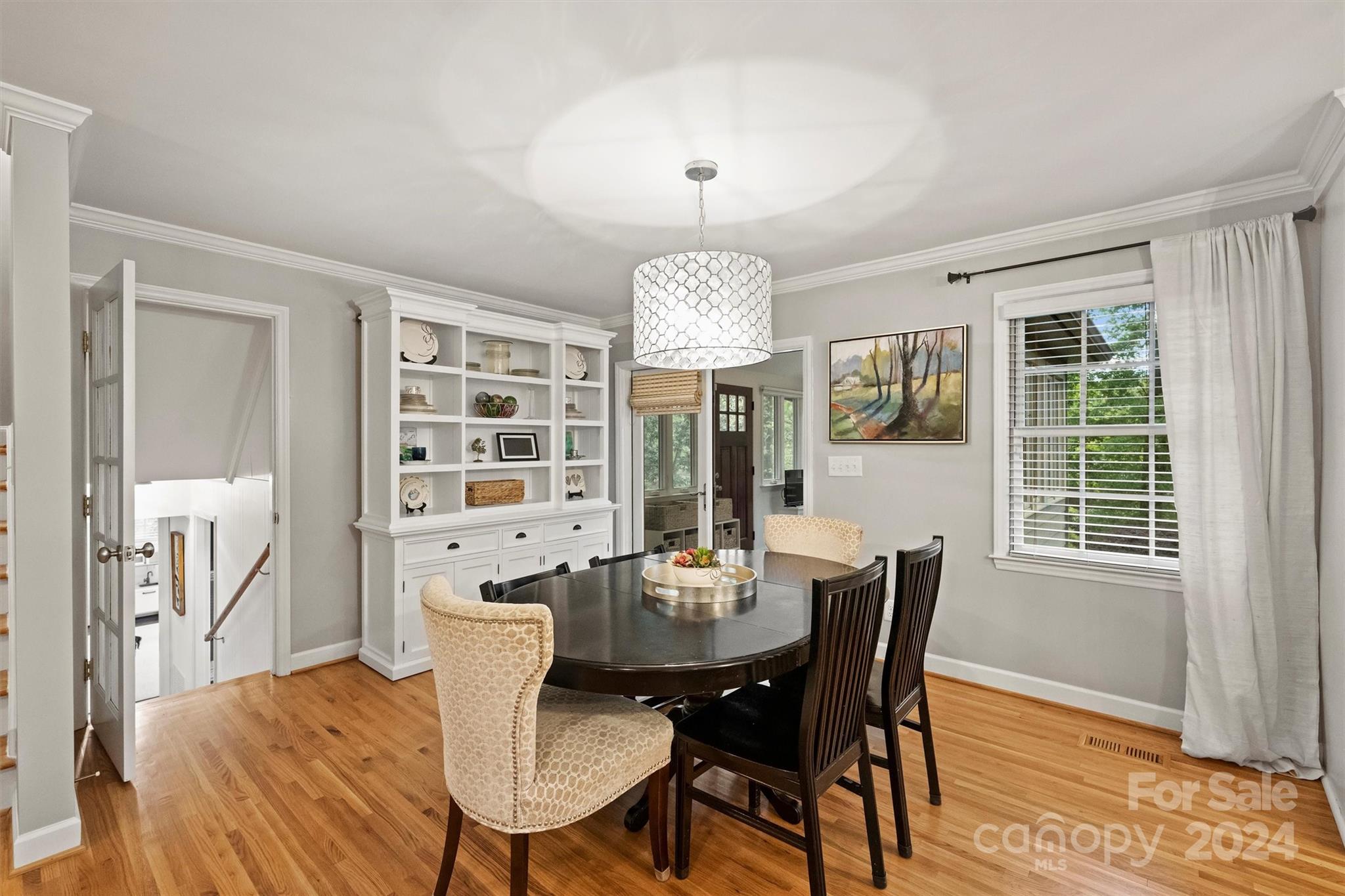 3820 Sulkirk Road Charlotte, NC 28210 - Photo 19 of 48 a view of a dining room with furniture window and wooden floor