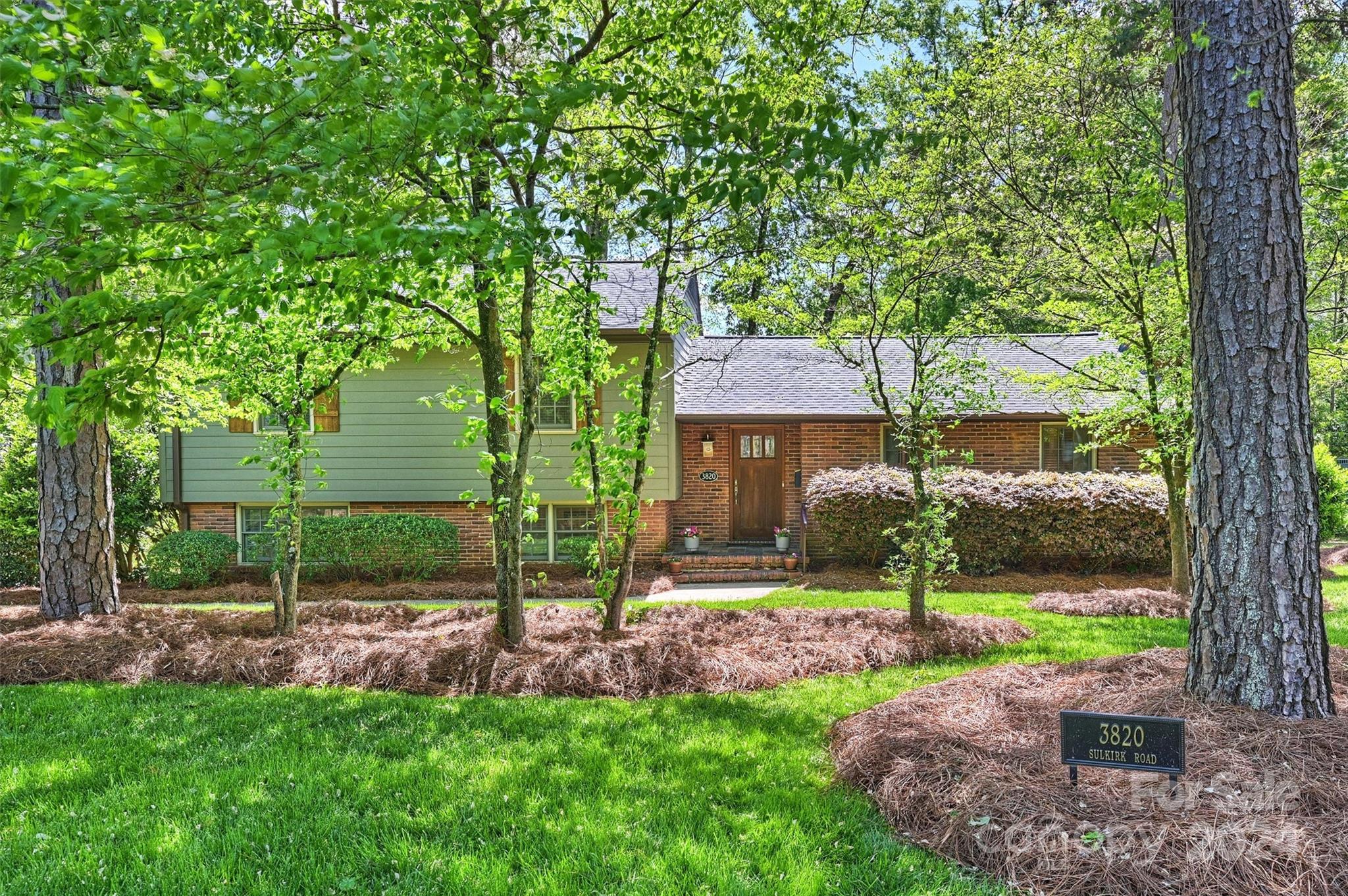 3820 Sulkirk Road Charlotte, NC 28210 - Photo 2 of 48 a front view of a house with garden