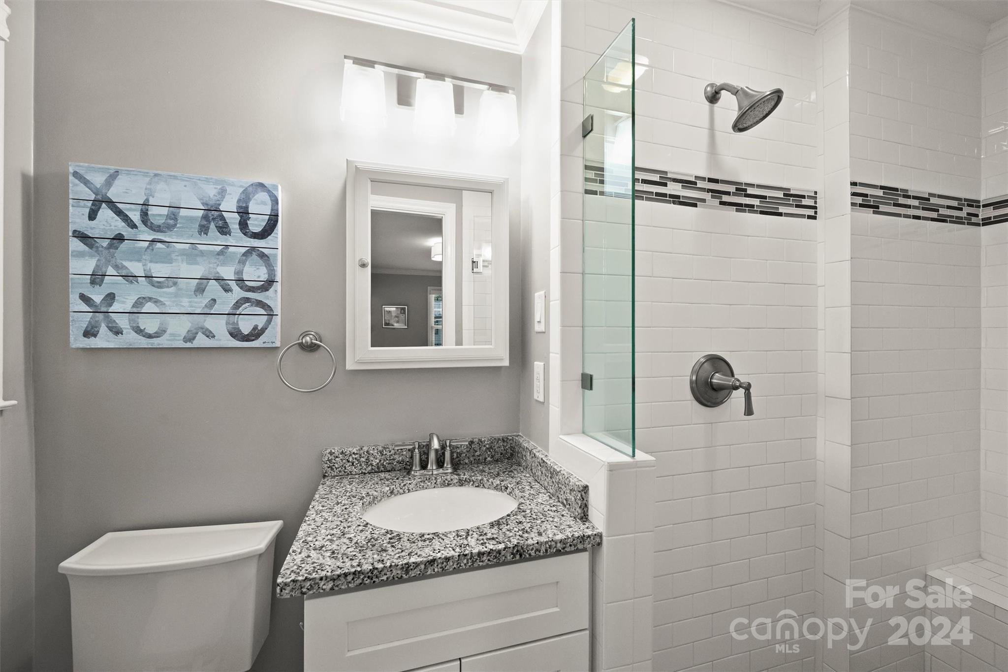 3820 Sulkirk Road Charlotte, NC 28210 - Photo 29 of 48 a bathroom with a granite countertop sink toilet and shower