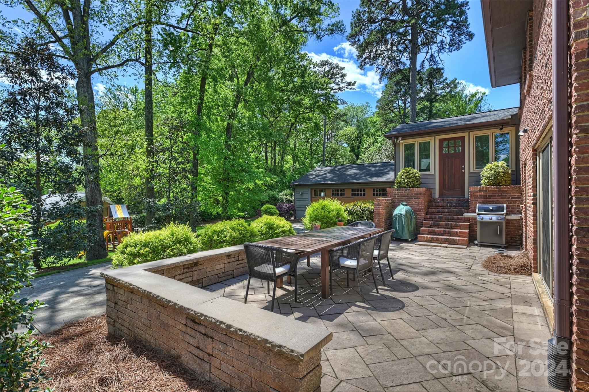 3820 Sulkirk Road Charlotte, NC 28210 - Photo 35 of 48 a view of backyard with outdoor seating and green space