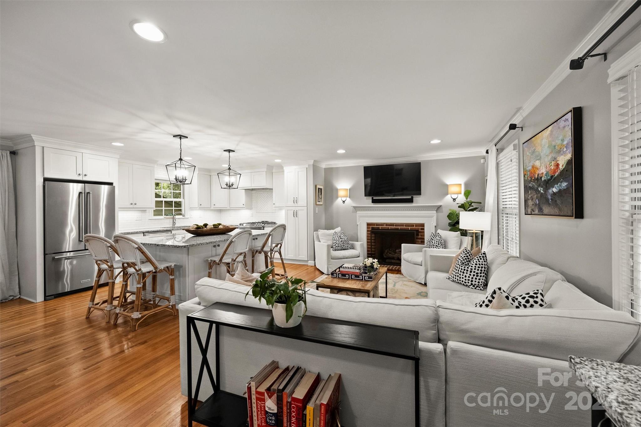 3820 Sulkirk Road Charlotte, NC 28210 - Photo 4 of 48 a living room with furniture a fireplace and a flat screen tv