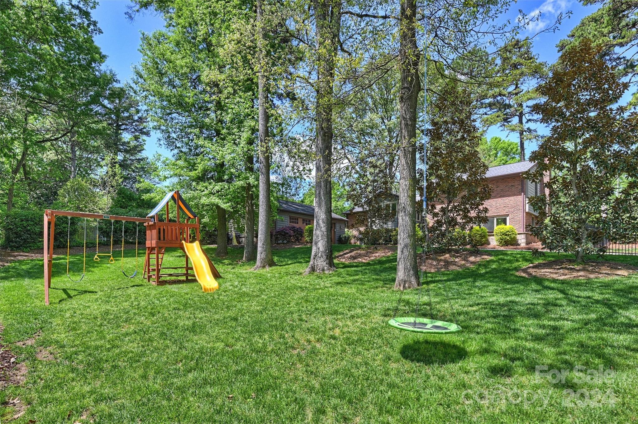 3820 Sulkirk Road Charlotte, NC 28210 - Photo 41 of 48 a view of a house with a backyard and a slide