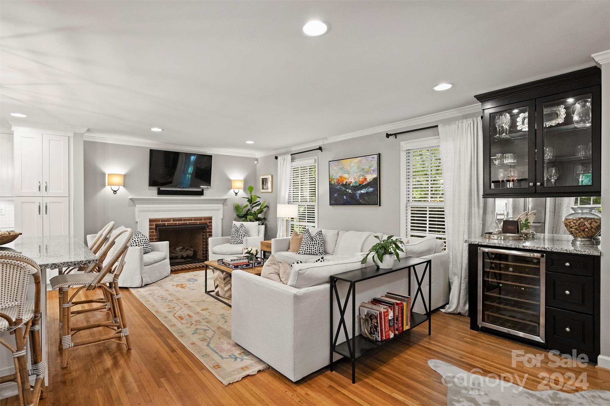 3820 Sulkirk Road Charlotte, NC 28210 - Photo 8 of 48 a living room with furniture a flat screen tv and a fireplace
