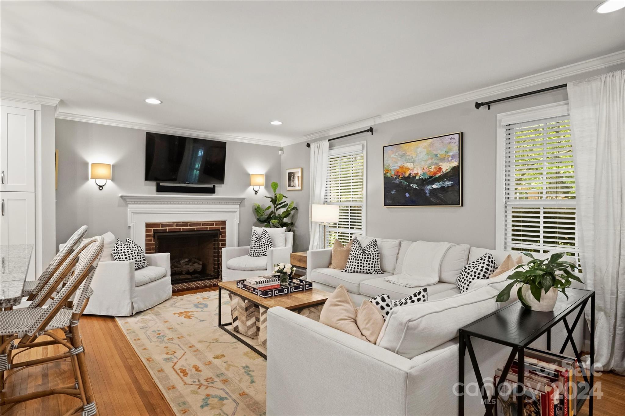 3820 Sulkirk Road Charlotte, NC 28210 - Photo 9 of 48 a living room with furniture a flat screen tv and a fireplace