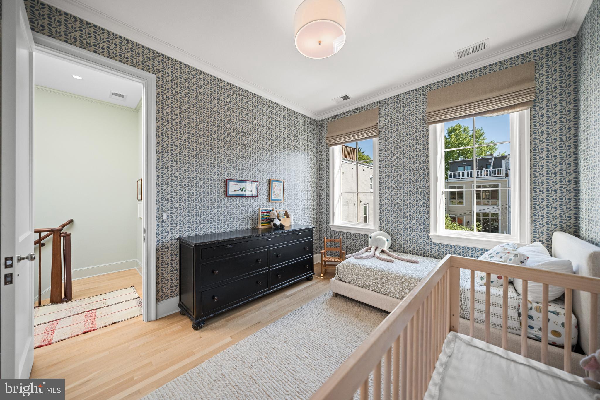 1304 S Street Northwest Washington, DC 20009 - Photo 12 of 23 a living room with furniture and a window