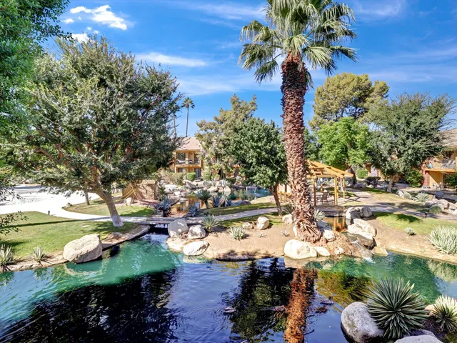 a view of swimming pool with outdoor seating