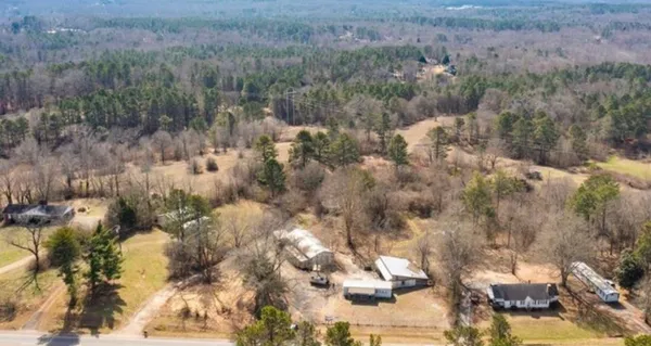 a view of a forest with a house