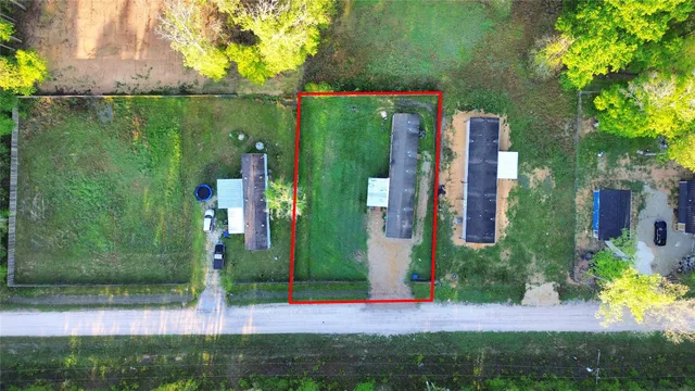 a view of a house with a yard and plants