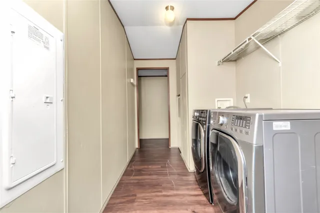a view of a hallway with washer and dryer