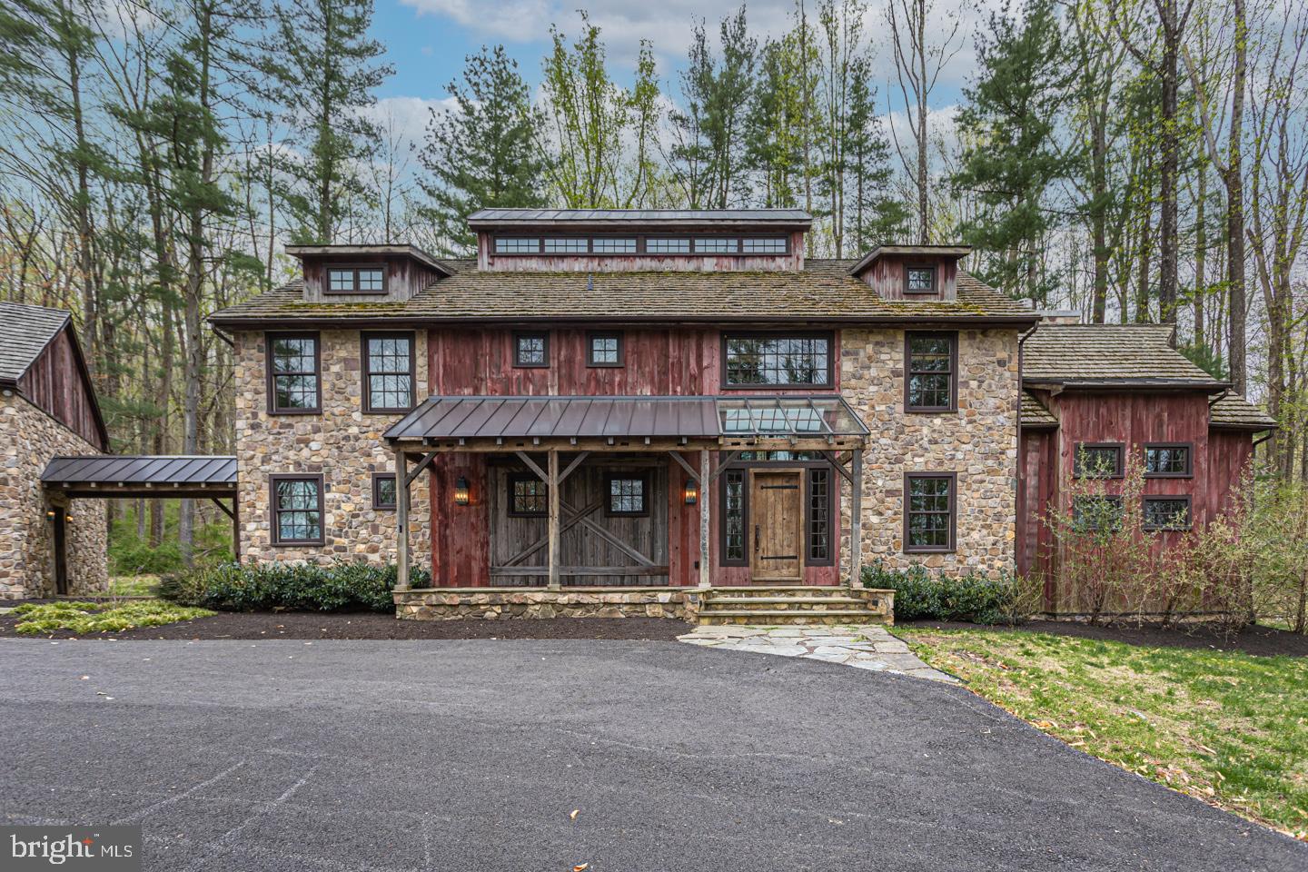 340 Thompson Mill Road New Hope, PA 18938 - Photo 2 of 76 a front view of a house with a garden
