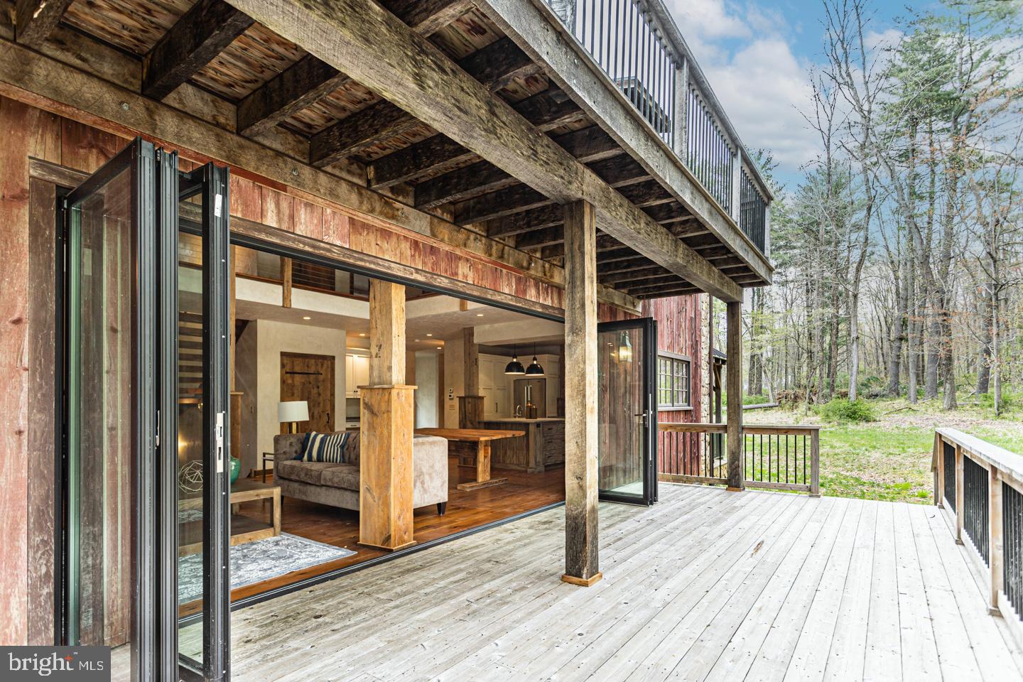 340 Thompson Mill Road New Hope, PA 18938 - Photo 14 of 76 a view of a porch with wooden floor and furniture