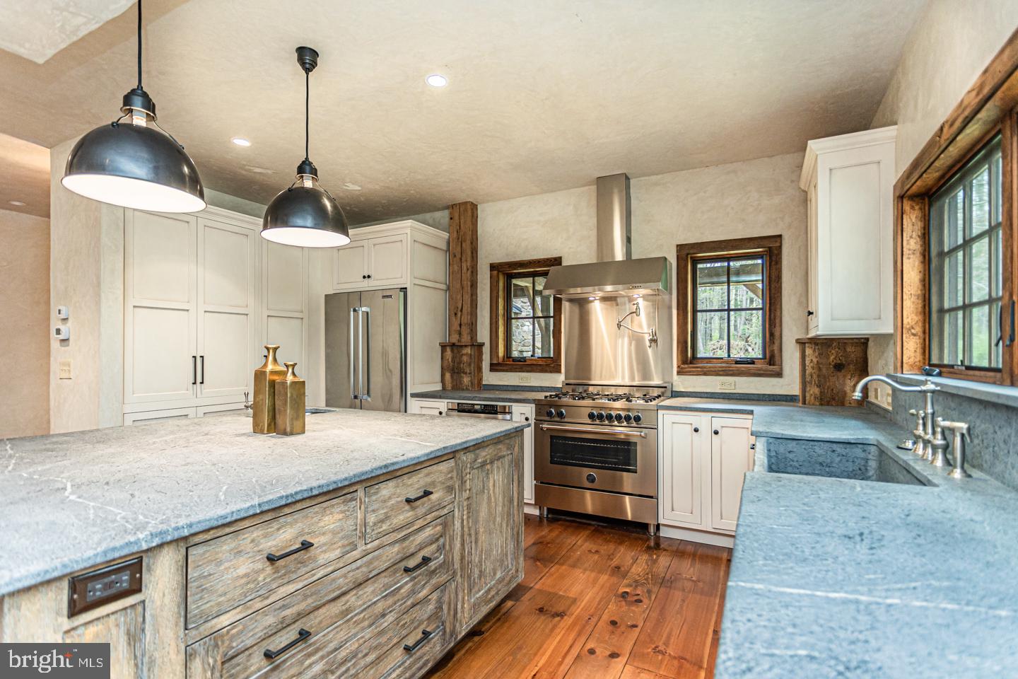 340 Thompson Mill Road New Hope, PA 18938 - Photo 16 of 76 a open kitchen with stainless steel appliances granite countertop a stove a sink and a refrigerator