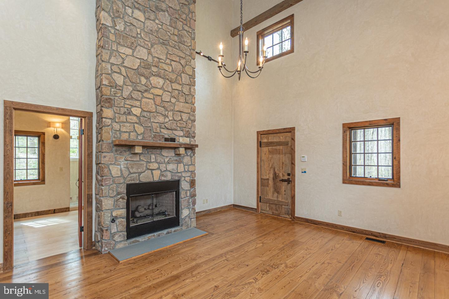 340 Thompson Mill Road New Hope, PA 18938 - Photo 26 of 76 a view of an empty room with wooden floor and a window