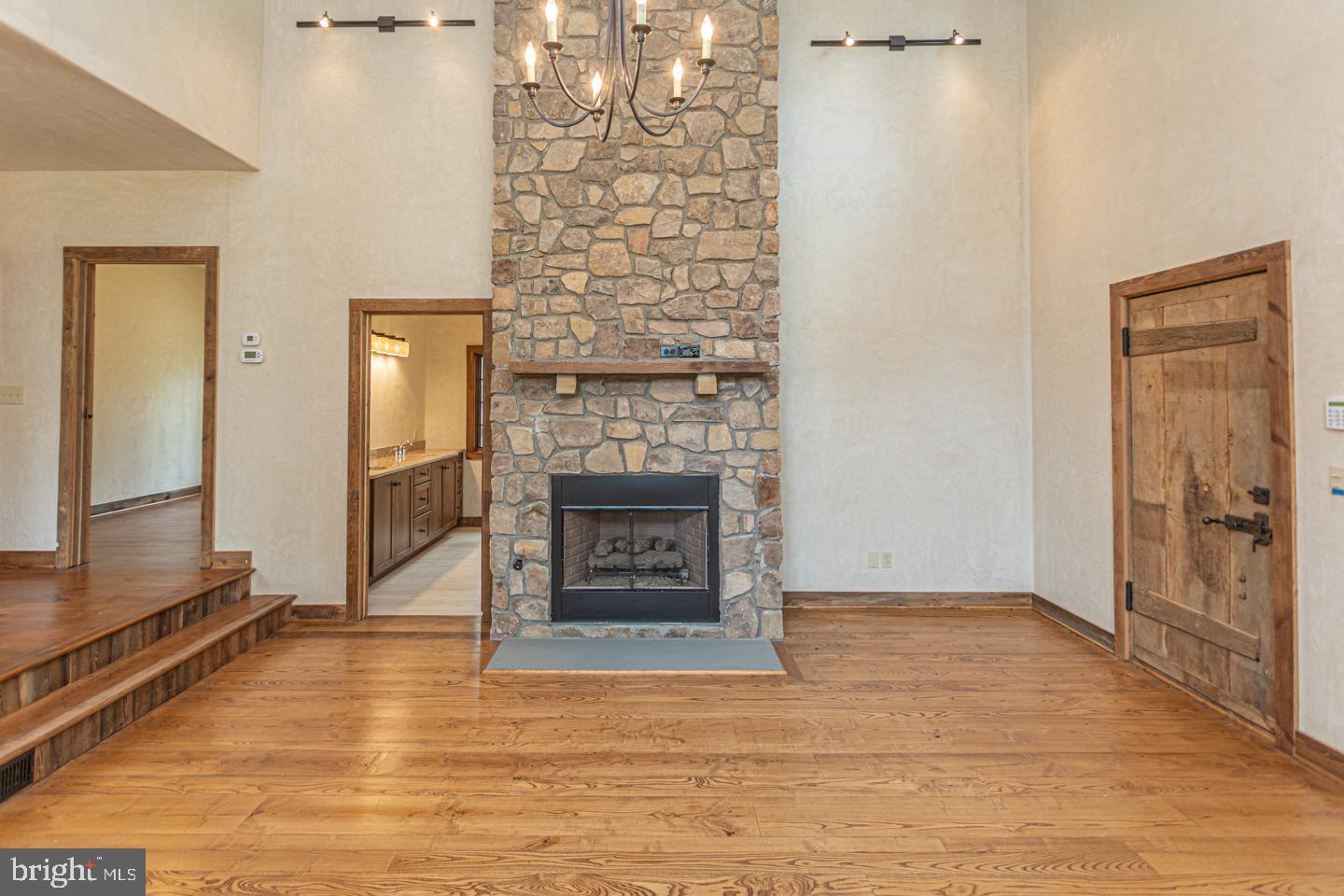 340 Thompson Mill Road New Hope, PA 18938 - Photo 28 of 76 a view of a livingroom with wooden floor and a fireplace