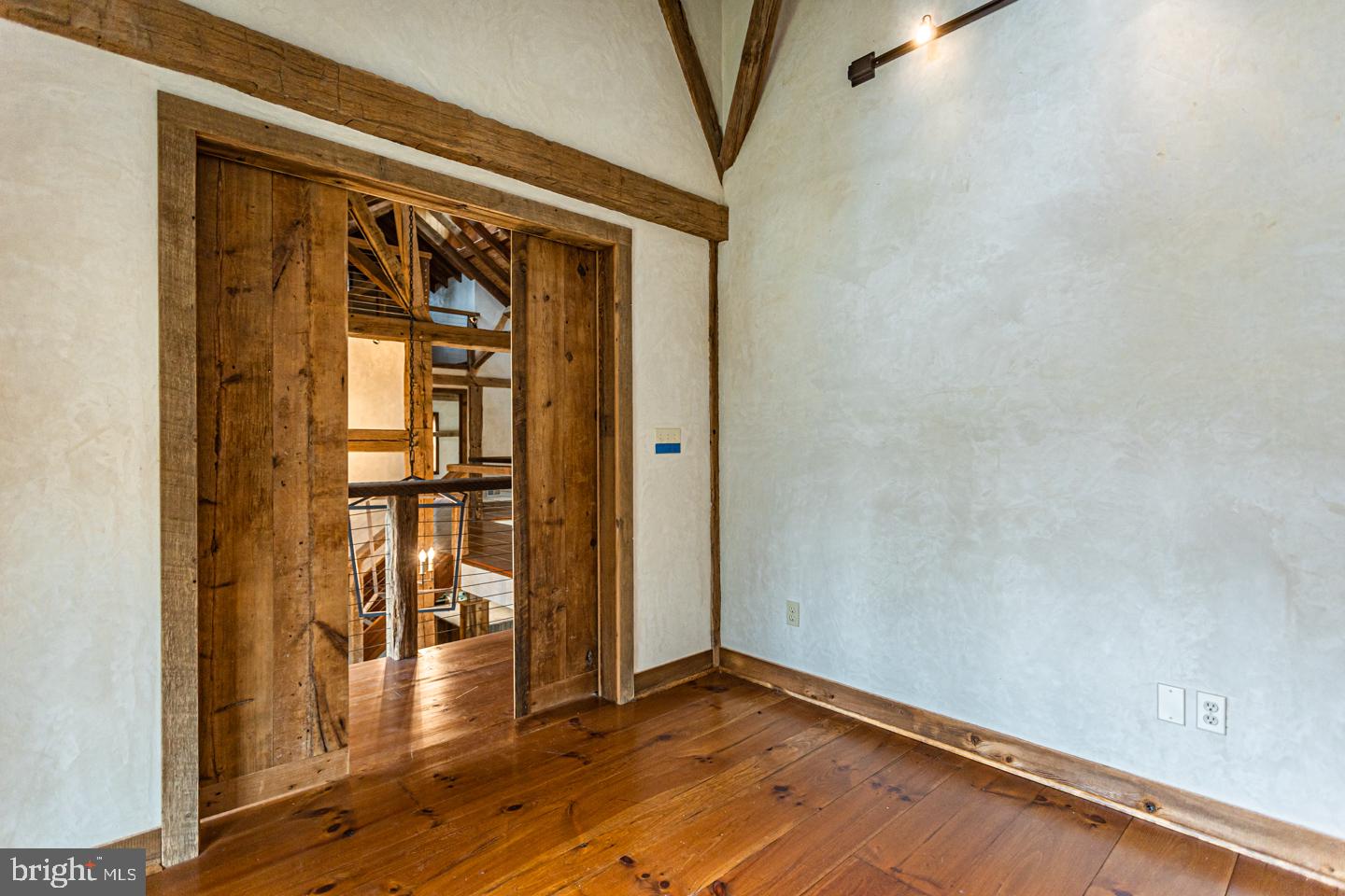 340 Thompson Mill Road New Hope, PA 18938 - Photo 37 of 76 a view of empty room with wooden floor