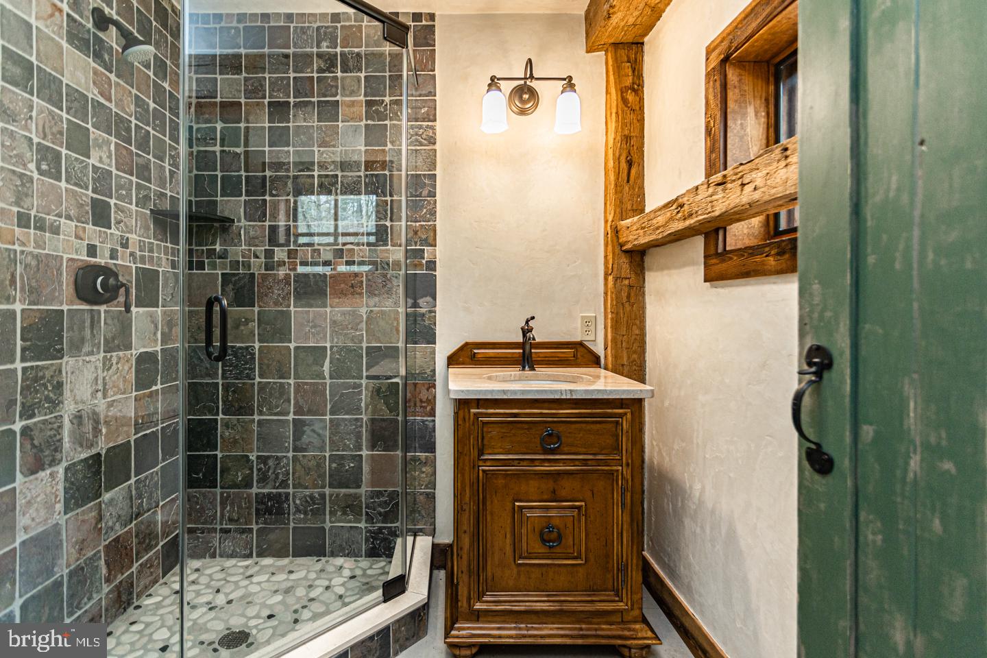 340 Thompson Mill Road New Hope, PA 18938 - Photo 46 of 76 a bathroom with a sink a toilet and shower