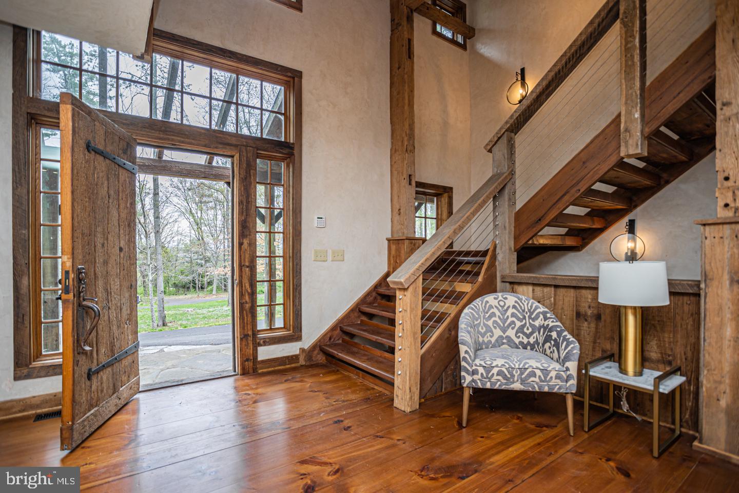 340 Thompson Mill Road New Hope, PA 18938 - Photo 55 of 76 a livingroom with furniture staircase and a floor to ceiling window