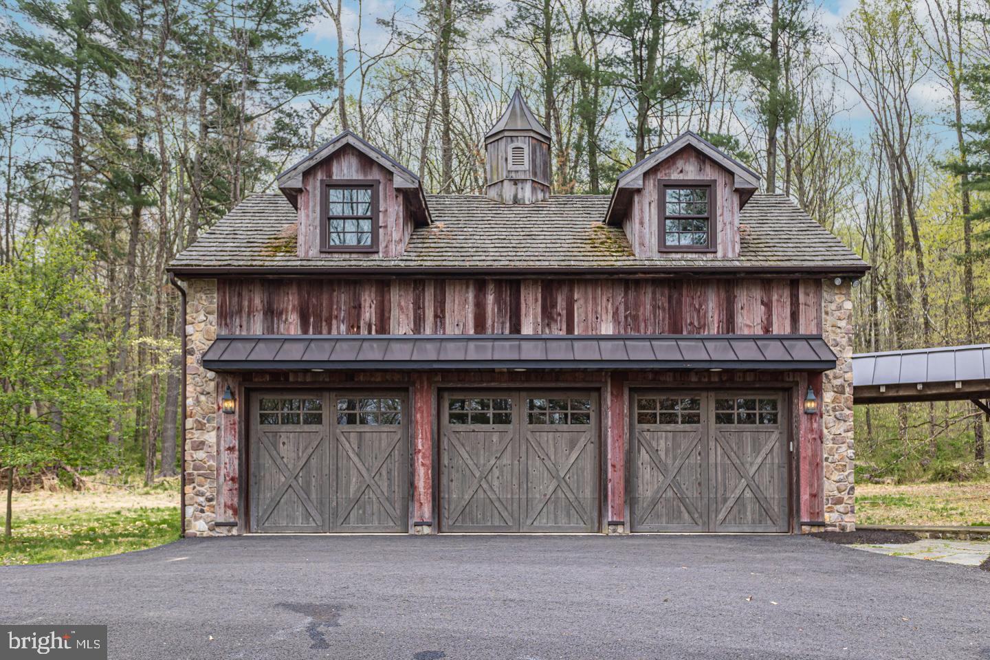 340 Thompson Mill Road New Hope, PA 18938 - Photo 63 of 76 a front view of a house with a garden and garage