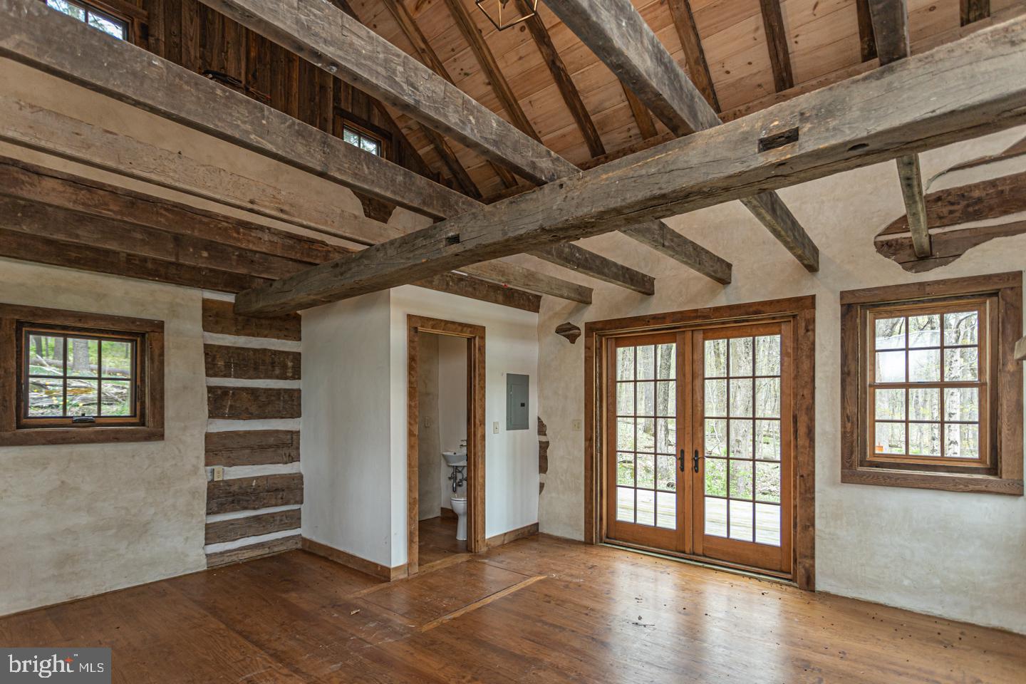 340 Thompson Mill Road New Hope, PA 18938 - Photo 73 of 76 a view of an empty room with wooden floor and windows