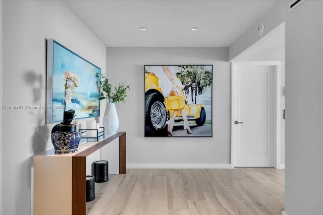 a view of a livingroom with furniture and a flat screen tv