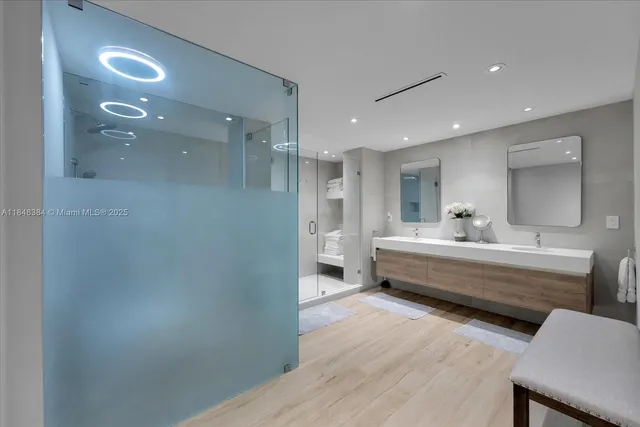 a bathroom with a double vanity sink and a mirror