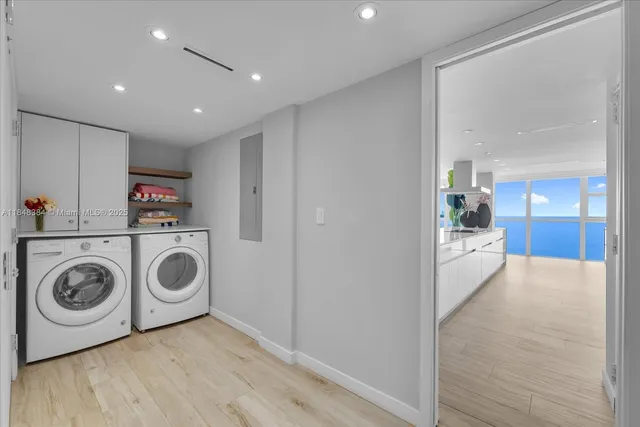 a view of a storage & utility room with washer and dryer