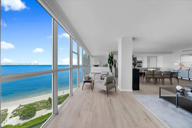 a living room with furniture and a table