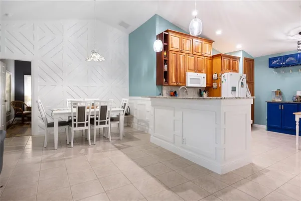 a kitchen with stainless steel appliances a stove a refrigerator and a sink