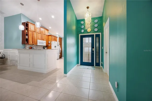 a kitchen with stainless steel appliances granite countertop a sink and cabinets