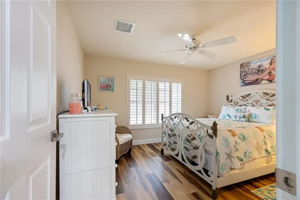 a bedroom with bed and a window