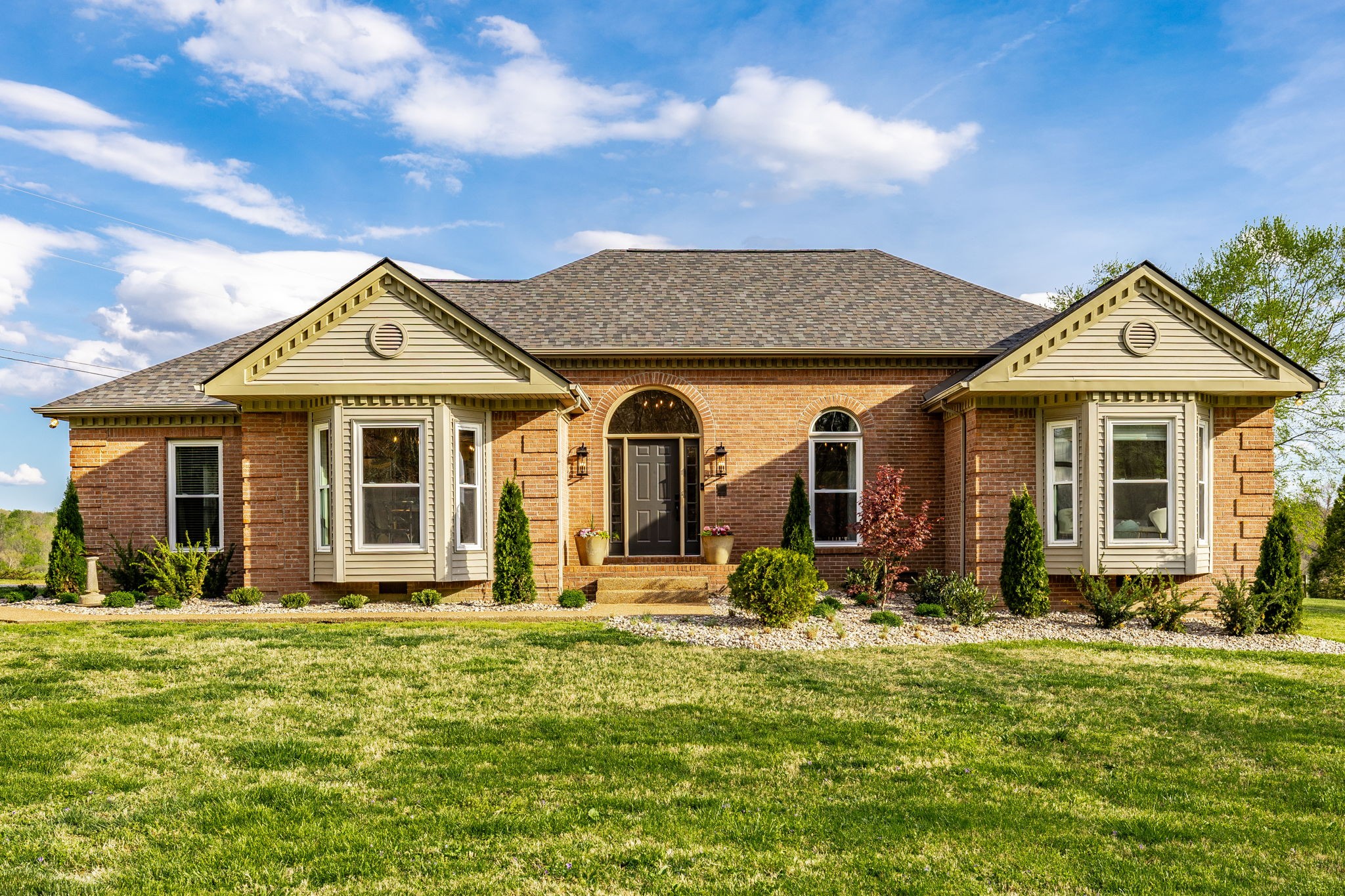 1075 Fannie Nicholson Road Chapmansboro, TN 37035 - Photo 12 of 100 a front view of a house with a yard