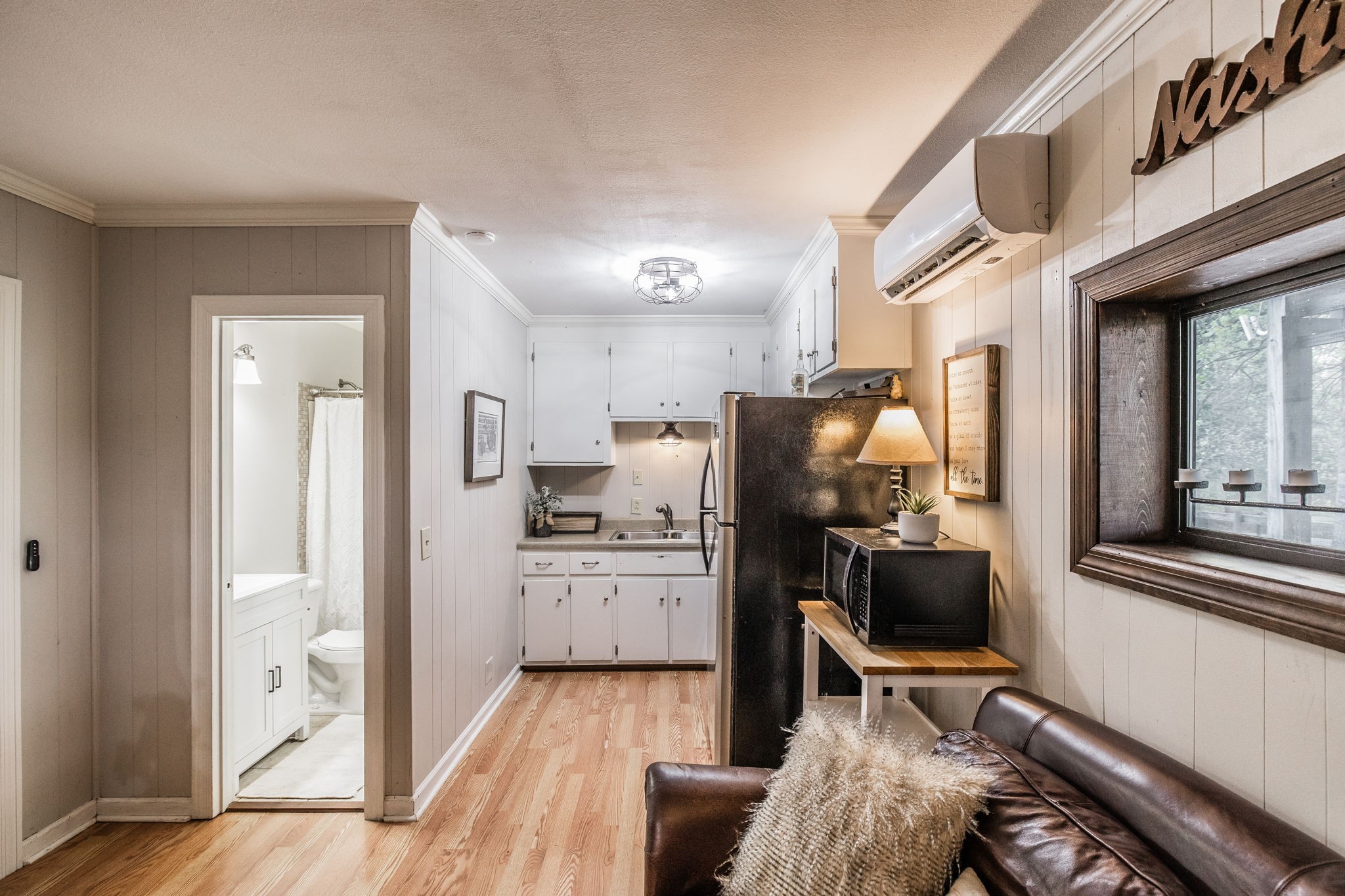 1075 Fannie Nicholson Road Chapmansboro, TN 37035 - Photo 51 of 100 a kitchen with stainless steel appliances kitchen island granite countertop a refrigerator and a stove top oven