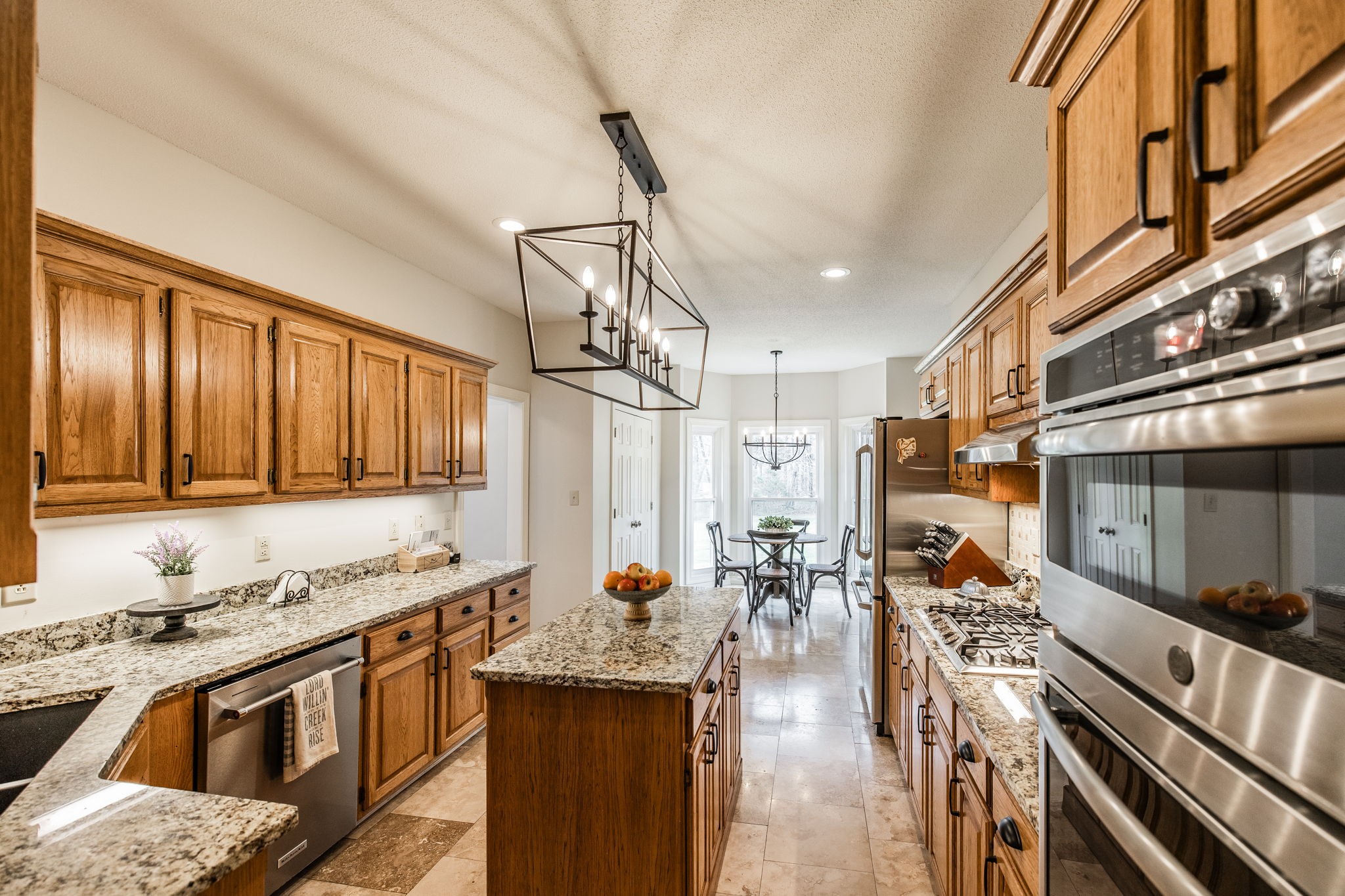 1075 Fannie Nicholson Road Chapmansboro, TN 37035 - Photo 72 of 100 a kitchen with stainless steel appliances granite countertop a stove and a sink