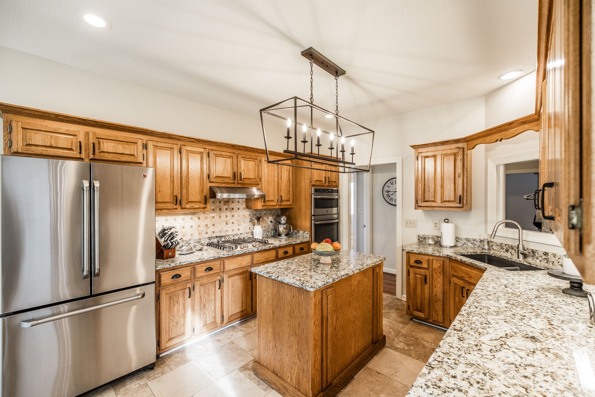 1075 Fannie Nicholson Road Chapmansboro, TN 37035 - Photo 74 of 100 a kitchen with stainless steel appliances granite countertop a sink stove and refrigerator