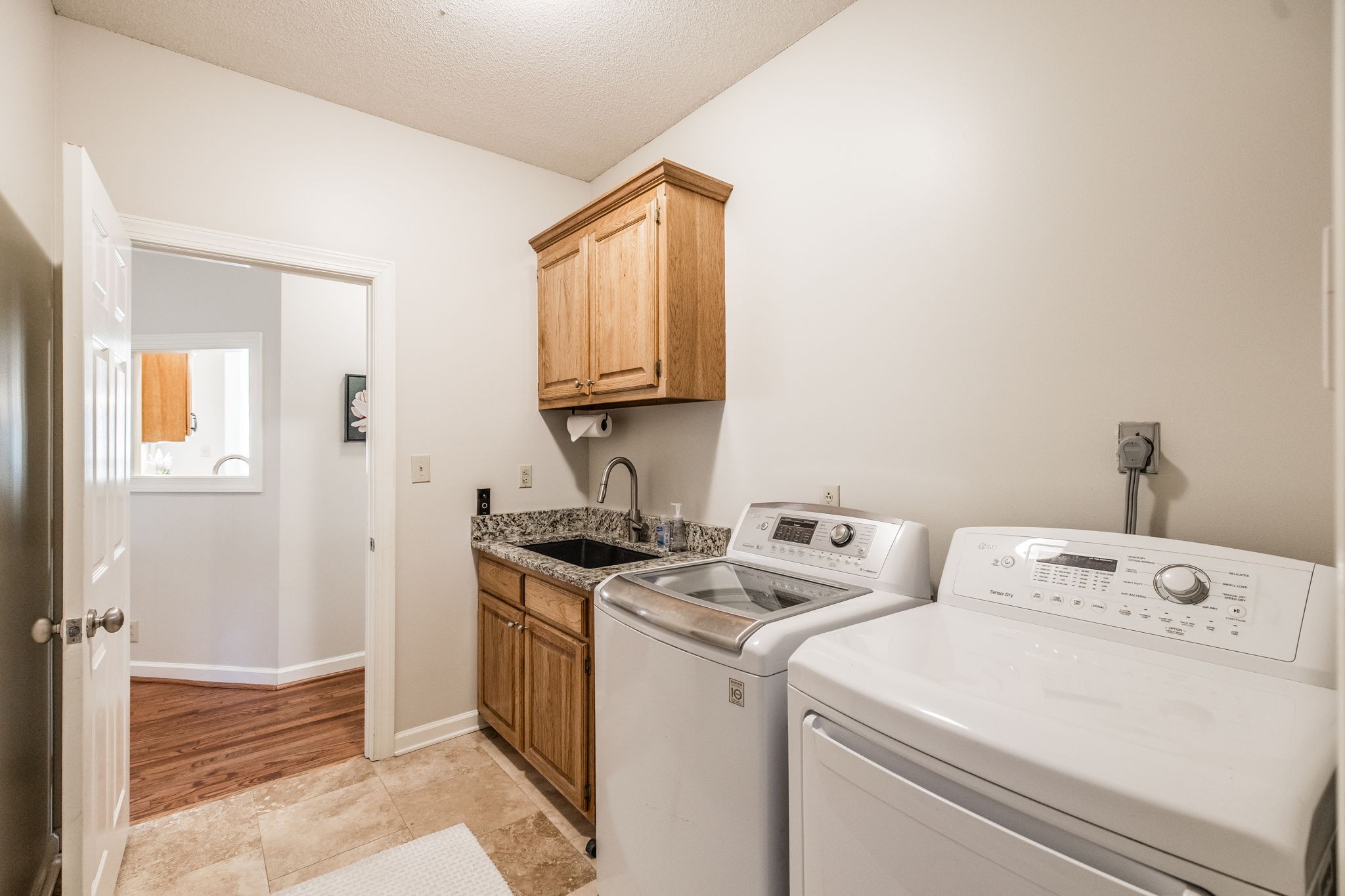 1075 Fannie Nicholson Road Chapmansboro, TN 37035 - Photo 89 of 100 a view of washer and dryer with bathroom in the background