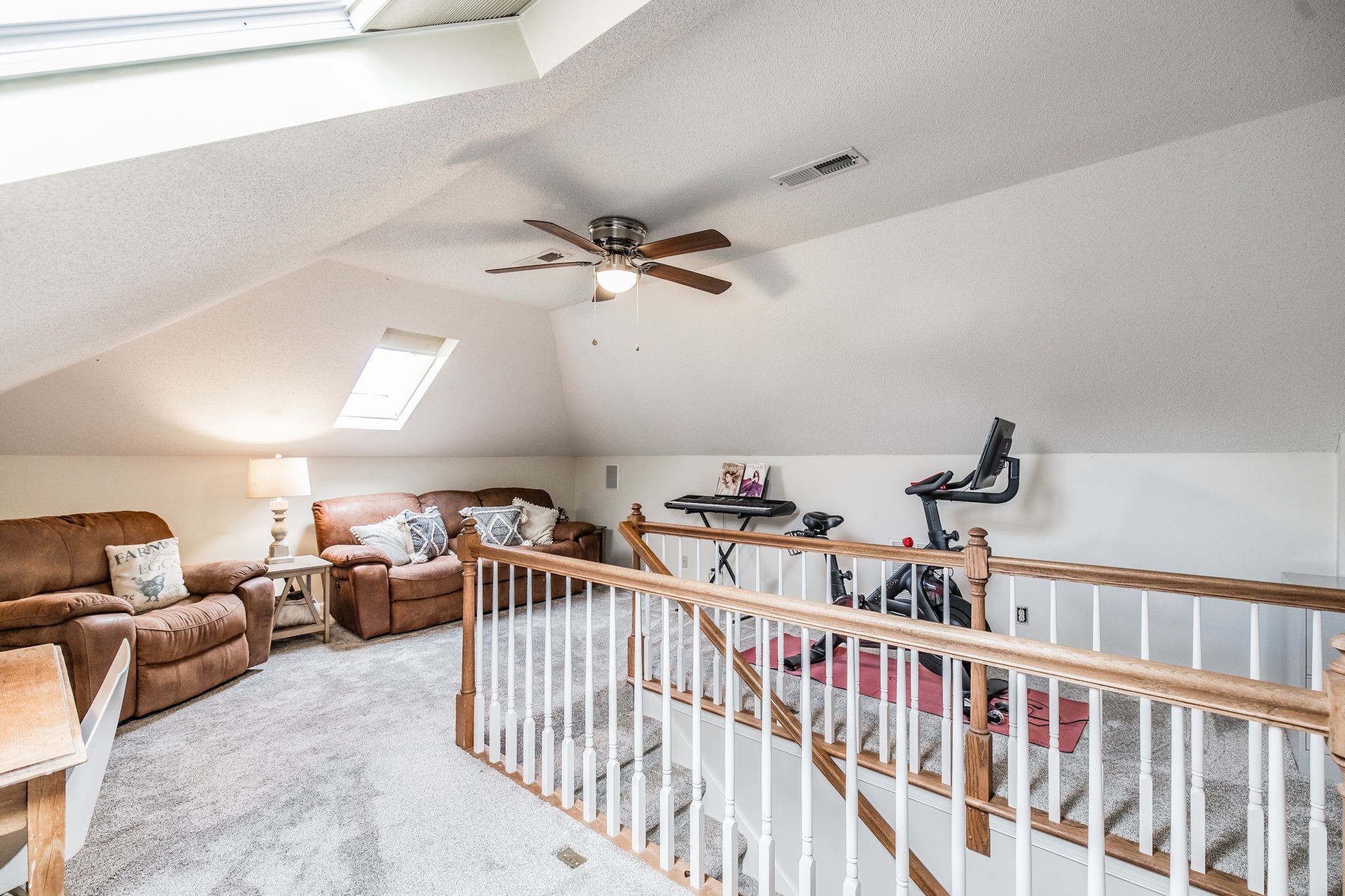 1075 Fannie Nicholson Road Chapmansboro, TN 37035 - Photo 93 of 100 a living room with furniture a ceiling fan and a rug