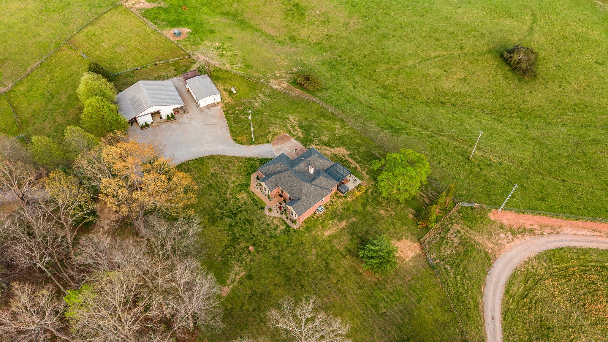 1075 Fannie Nicholson Road Chapmansboro, TN 37035 - Photo 10 of 100 an aerial view of residential house with swimming pool