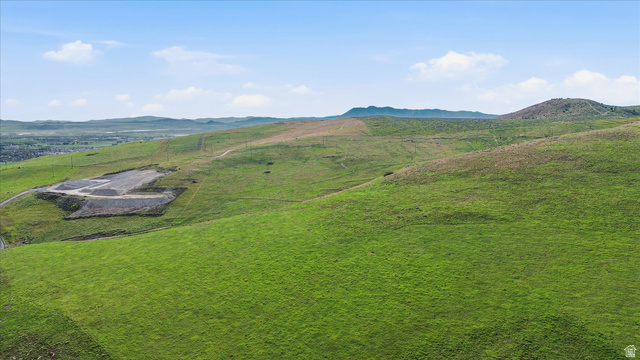 2075 Canyon Road Smithfield, UT 84335 - Photo 7 of 18 Expansive green hills with a distant city outline