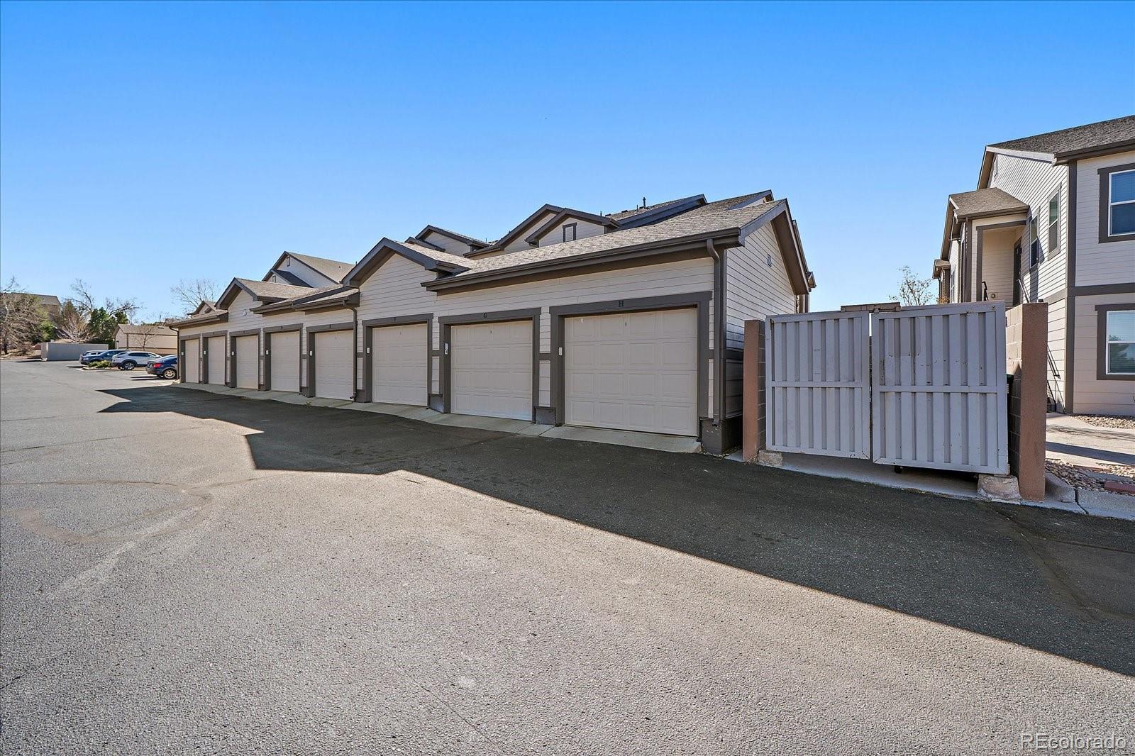 4474 Copeland Circle, Unit 203 Highlands Ranch, CO 80126 - Photo 24 of 33 a view of a house with wooden fence
