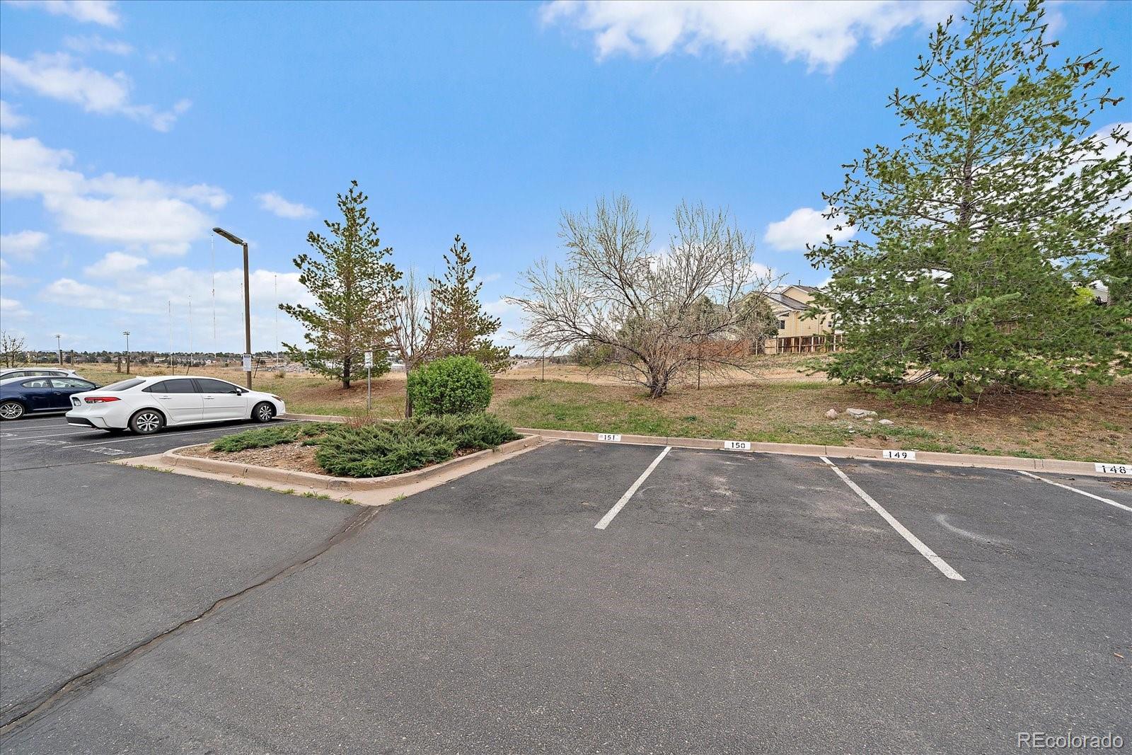 4474 Copeland Circle, Unit 203 Highlands Ranch, CO 80126 - Photo 26 of 33 a view of street with parked cars