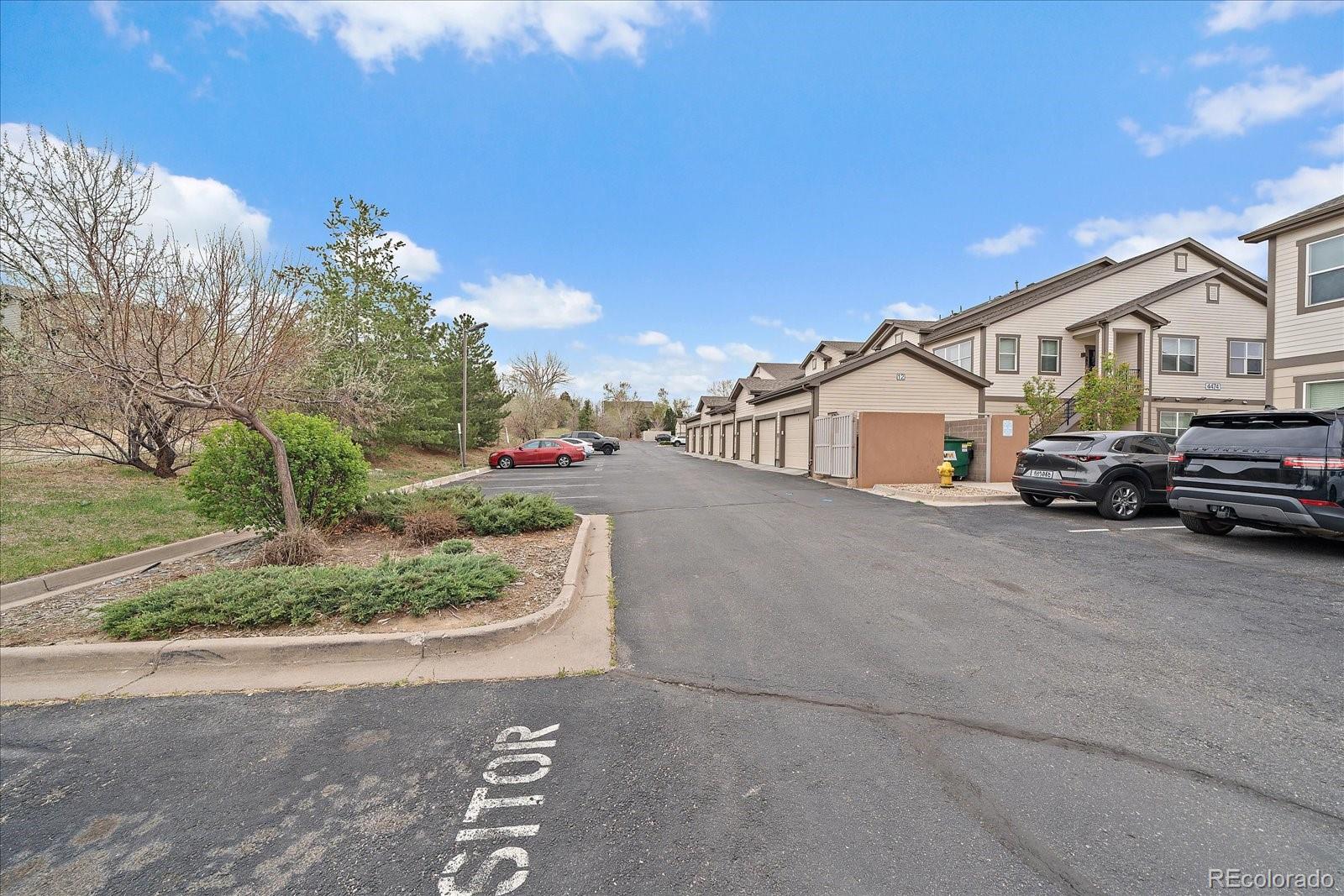 4474 Copeland Circle, Unit 203 Highlands Ranch, CO 80126 - Photo 28 of 33 a view of a car park in front of house