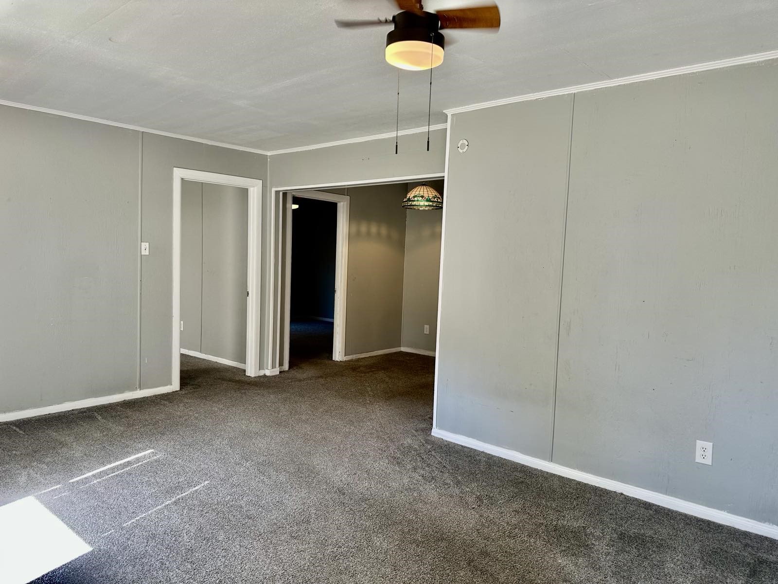 1907 Avenue C, Unit 3 Rosenberg, TX 77471 - Photo 18 of 20 an empty room with a ceiling fan and shower