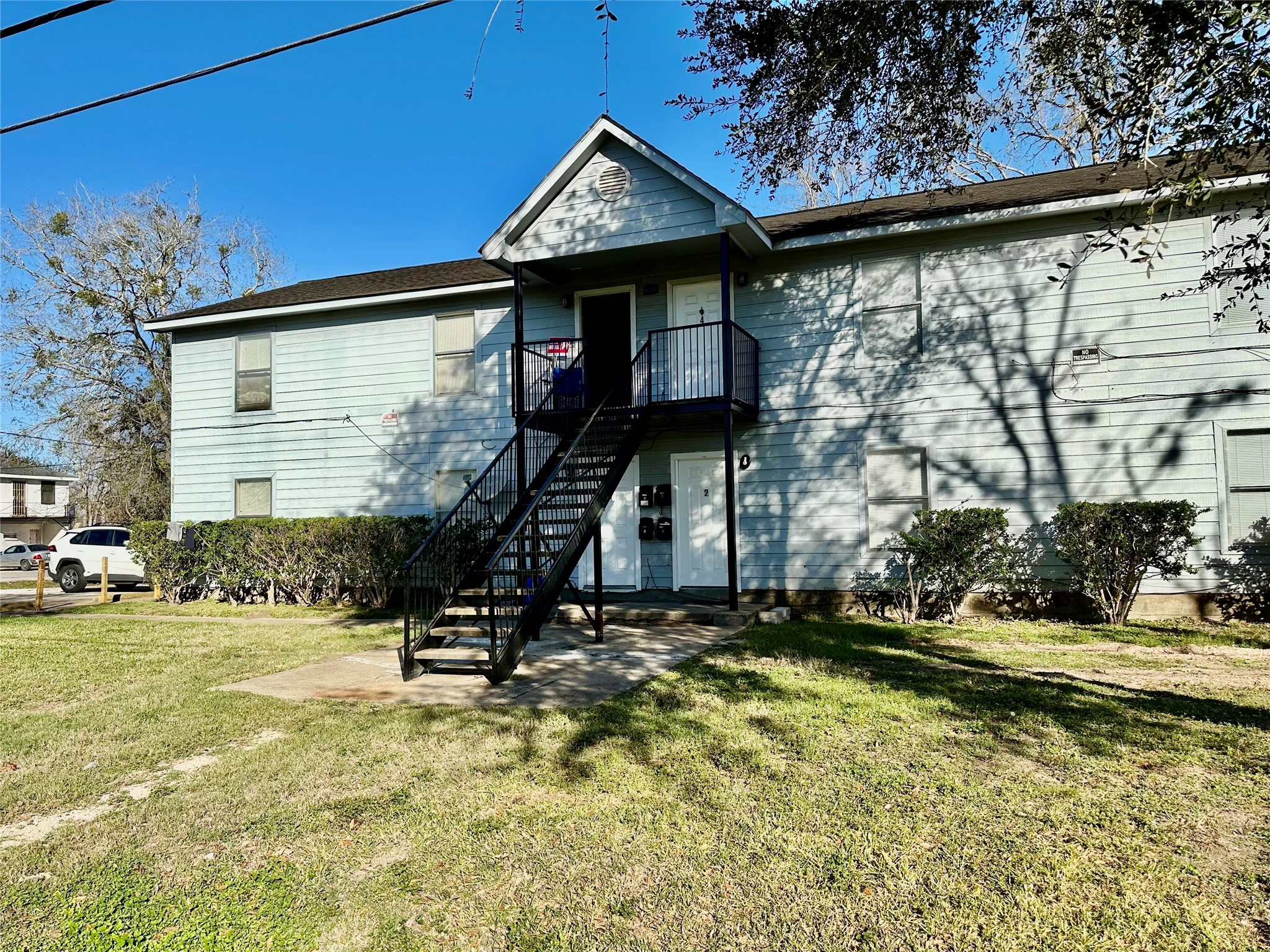 1907 Avenue C, Unit 3 Rosenberg, TX 77471 - Photo 21 of 22 a view of a house with a yard