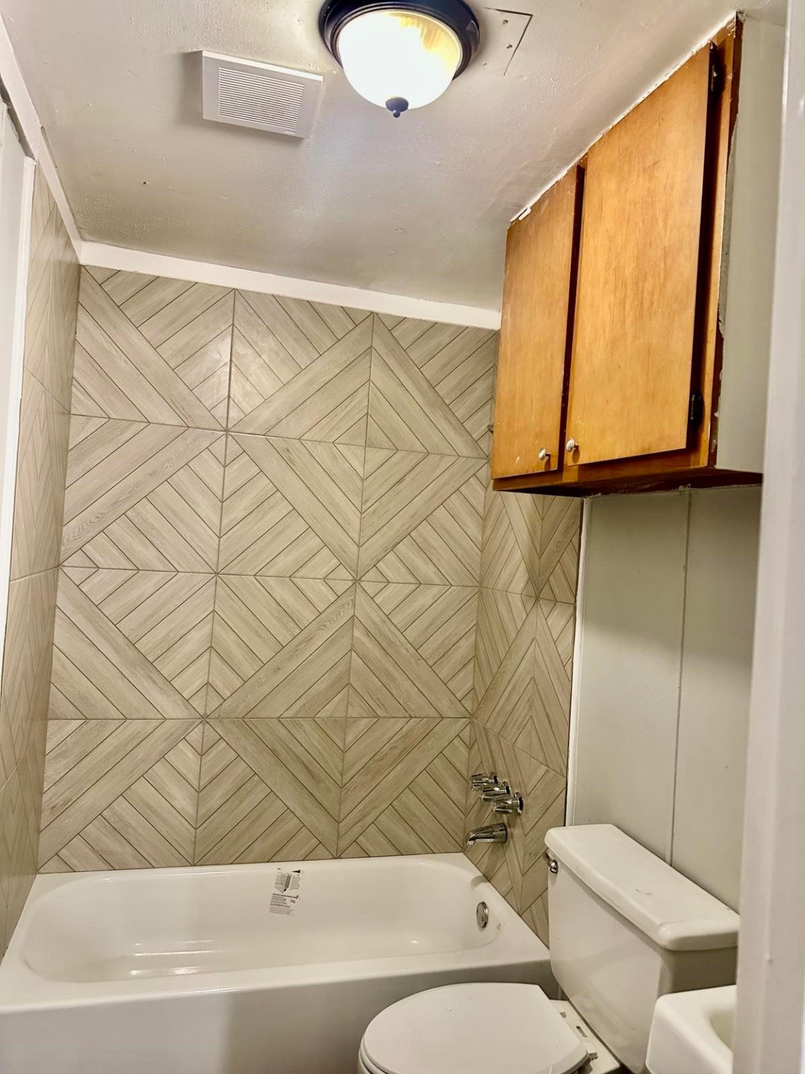 1907 Avenue C, Unit 3 Rosenberg, TX 77471 - Photo 4 of 20 a bathroom with a toilet sink and mirror