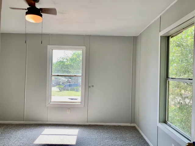 an empty room with windows