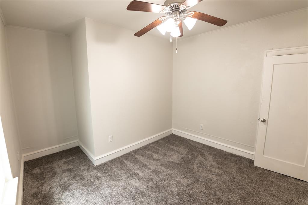 1525 Proctor Avenue Waco, TX 76708 - Photo 13 of 14 an empty room with a fan and a fan