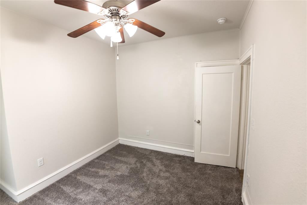1525 Proctor Avenue Waco, TX 76708 - Photo 4 of 14 an empty room with a chandelier fan