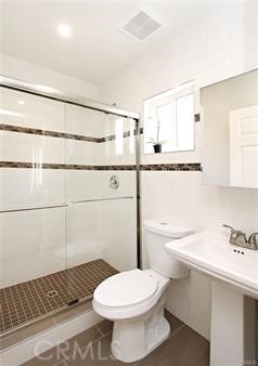 1007 Del Rey Avenue Pasadena, CA 91107 - Photo 14 of 15 a bathroom with a sink toilet and shower